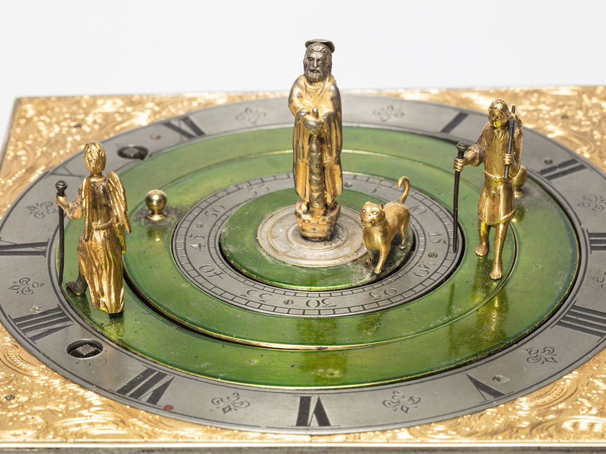 Logo Gastspiel: Tischuhr mit Figuren